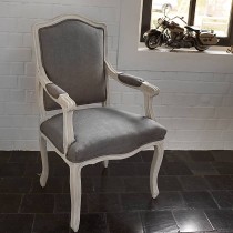 Armchair in patinated wood